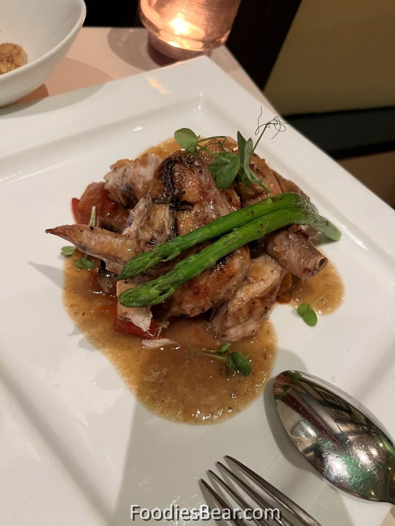 traditional Spanish slow-cooked chicken with asparagus